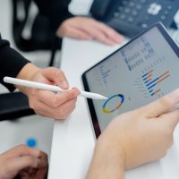 A close-up of the marketing team trying to explain the company’